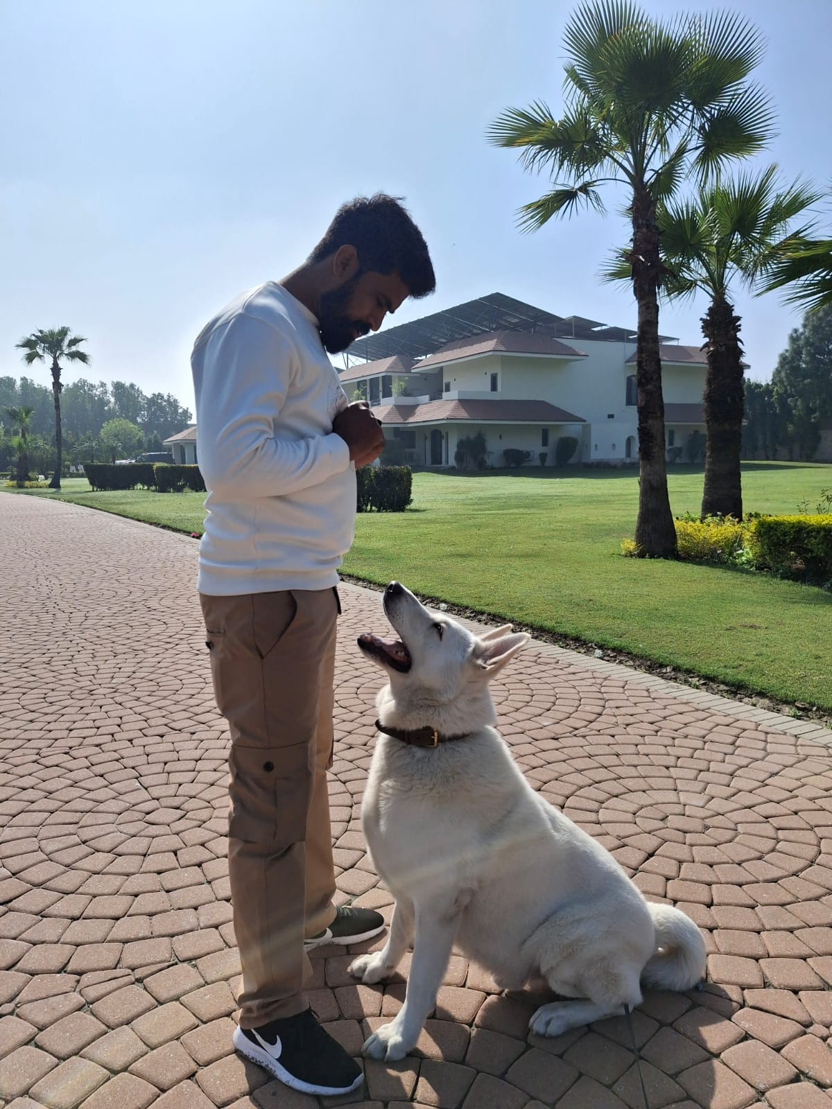 Sameer training white dog